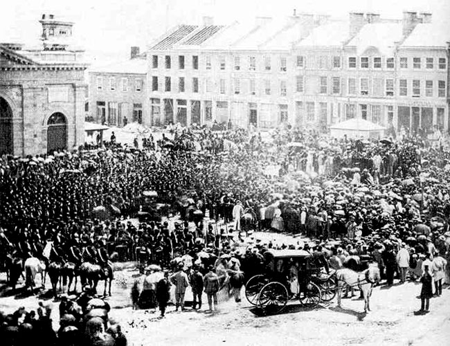 Reading the proclamation of Confederation in Market Square on 1 July (Queen's University Archives). Reading the proclamation of Confederation in Market Square on 1 July (QUA).