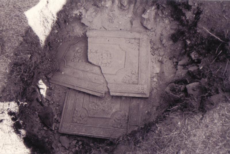 Stove parts in a debris pit in Cottage No. 16 prior to their removal.